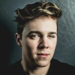 Intimate portrait capturing the thoughtful expression of a young man.